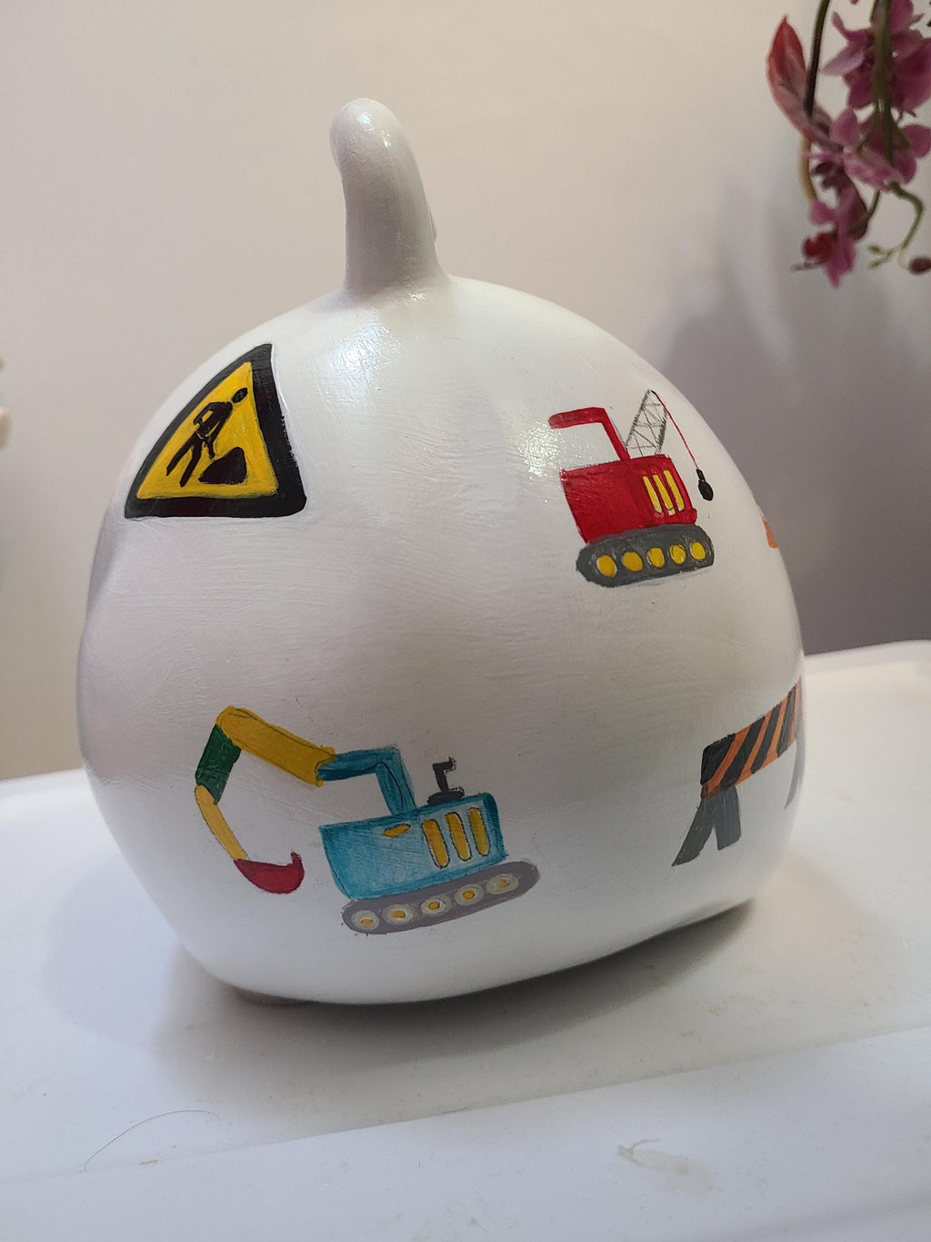 Large painted piggy construction theme piggy bank