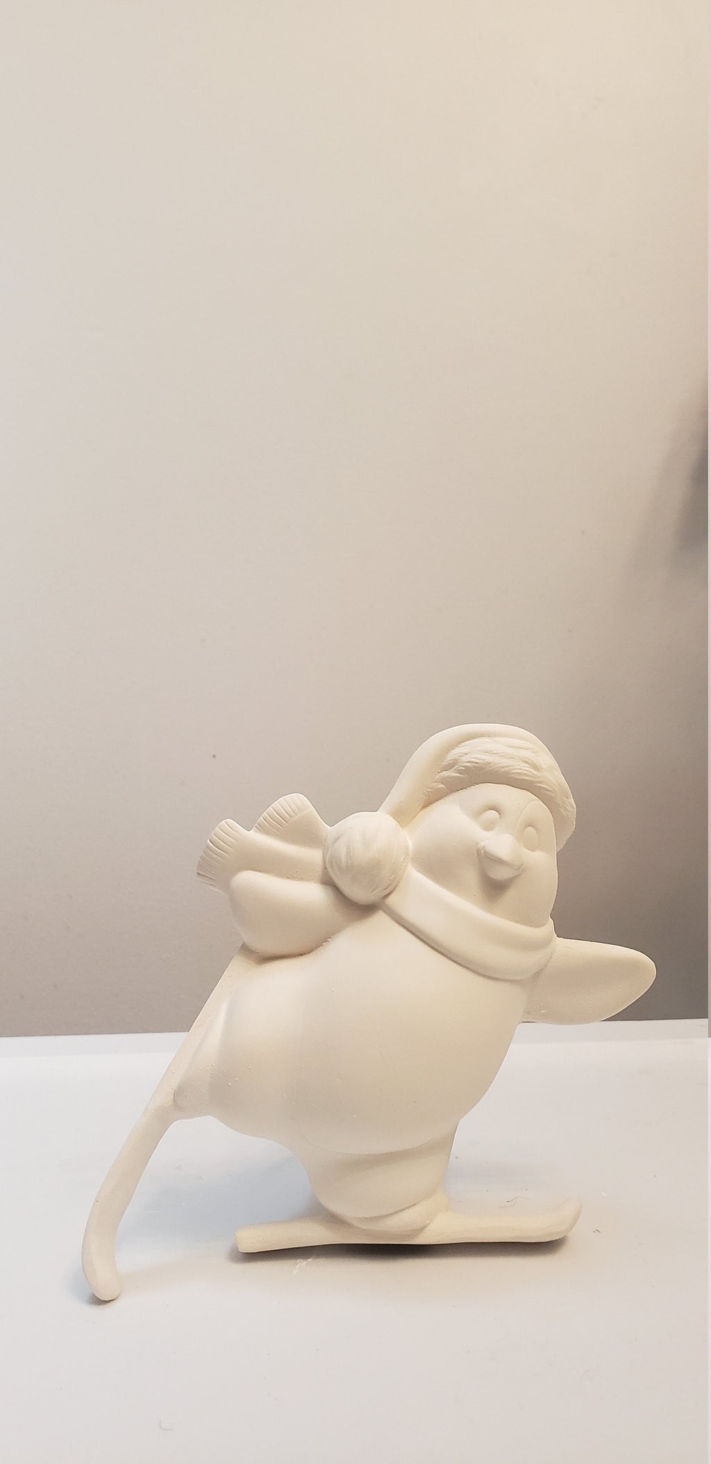 Penguin skiing bisque/Christmas decor bisque