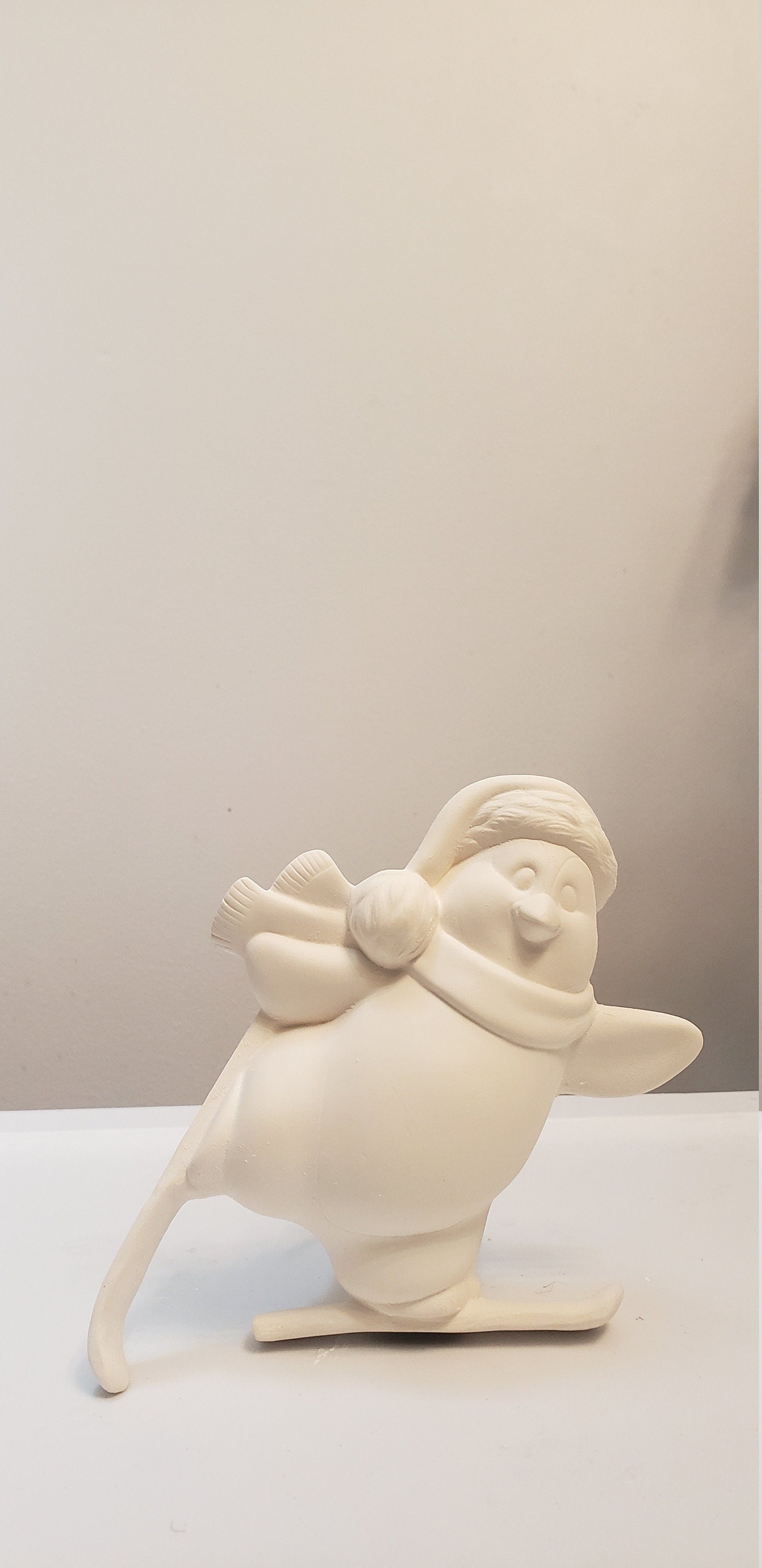 Penguin skiing bisque/Christmas decor bisque