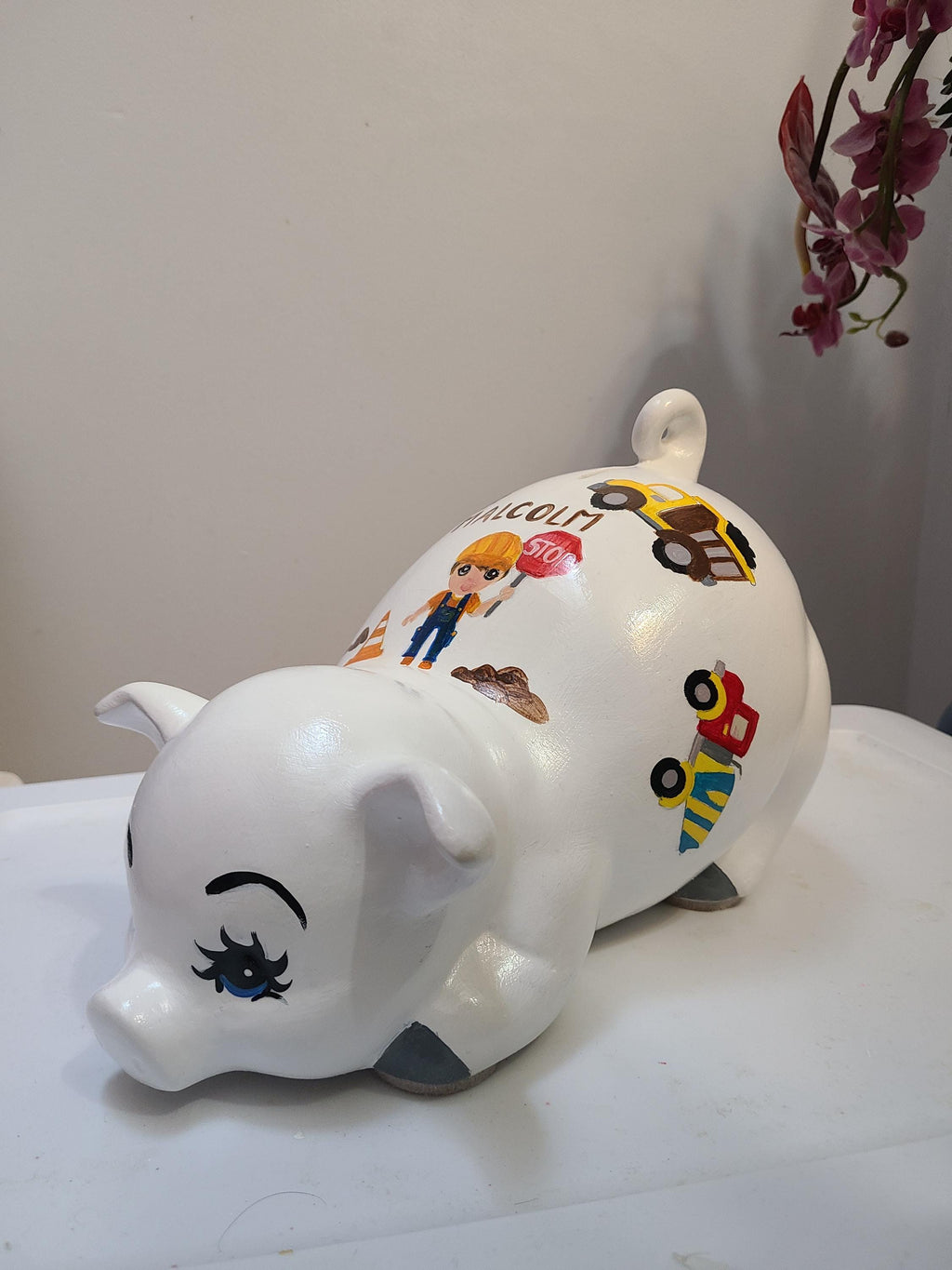 Large painted piggy construction theme piggy bank