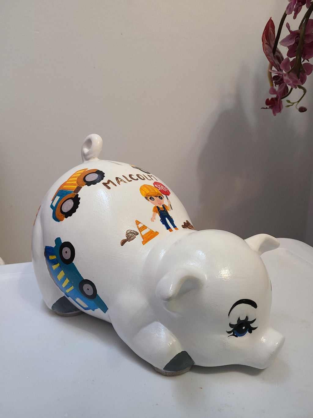 Large painted piggy construction theme piggy bank