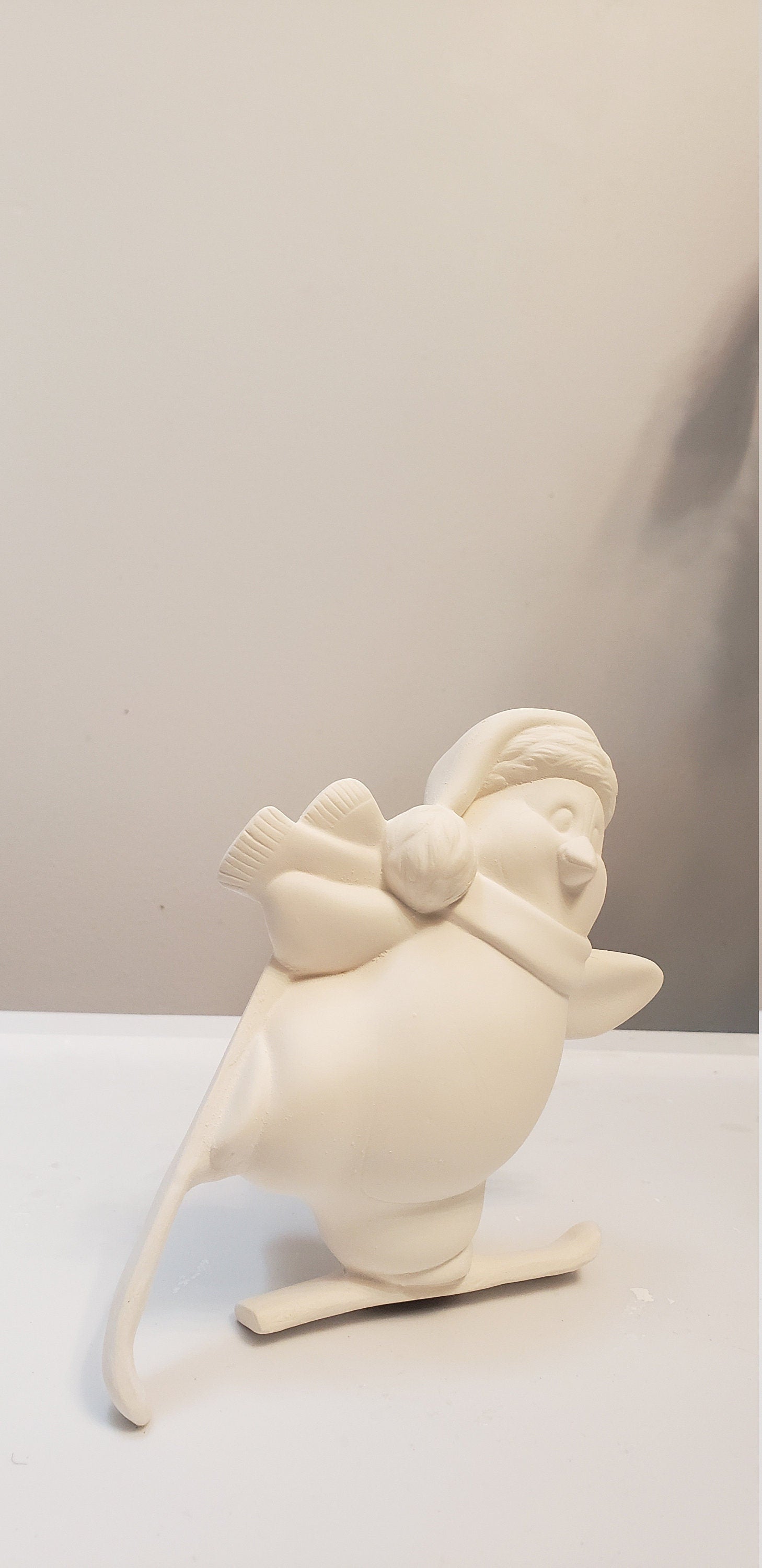 Penguin skiing bisque/Christmas decor bisque