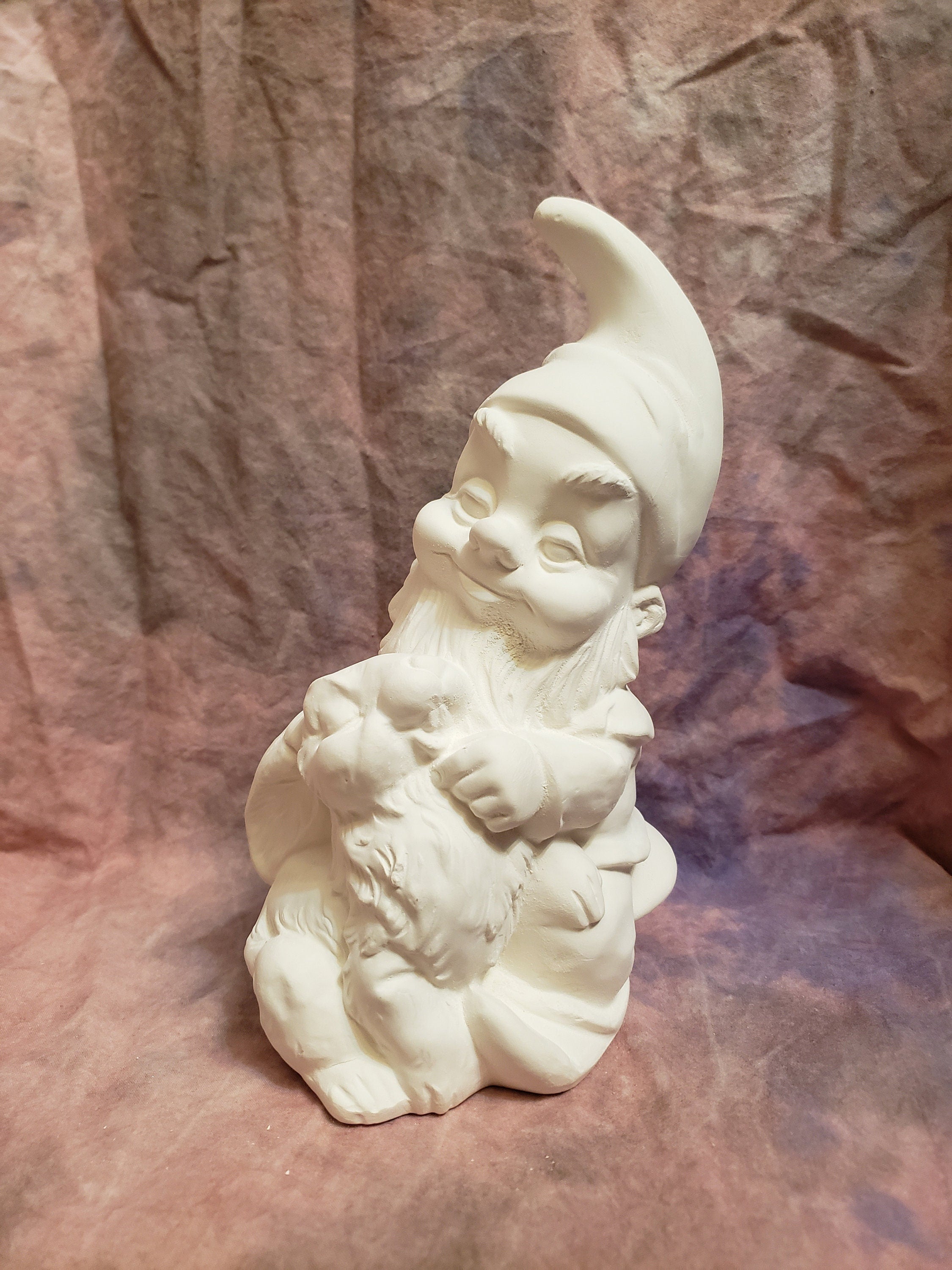 Large garden gnome with bunny